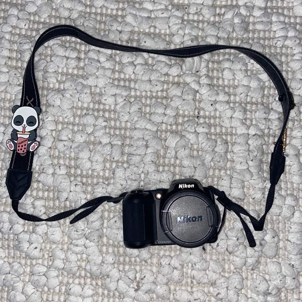 Black Nikon coolpix digital camera